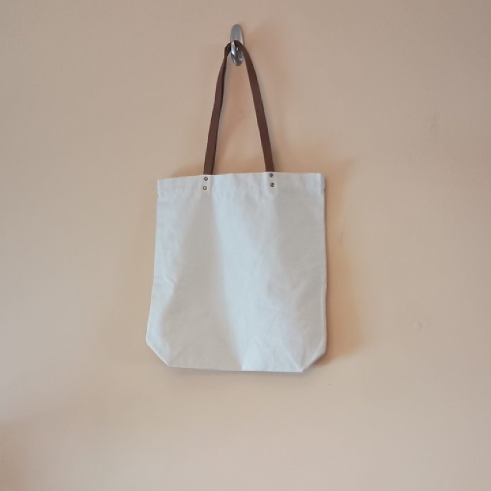 White Canvas Graphic Tote Bag About Parenting with Slightly Worn Brown Straps - Picture 2 of 4